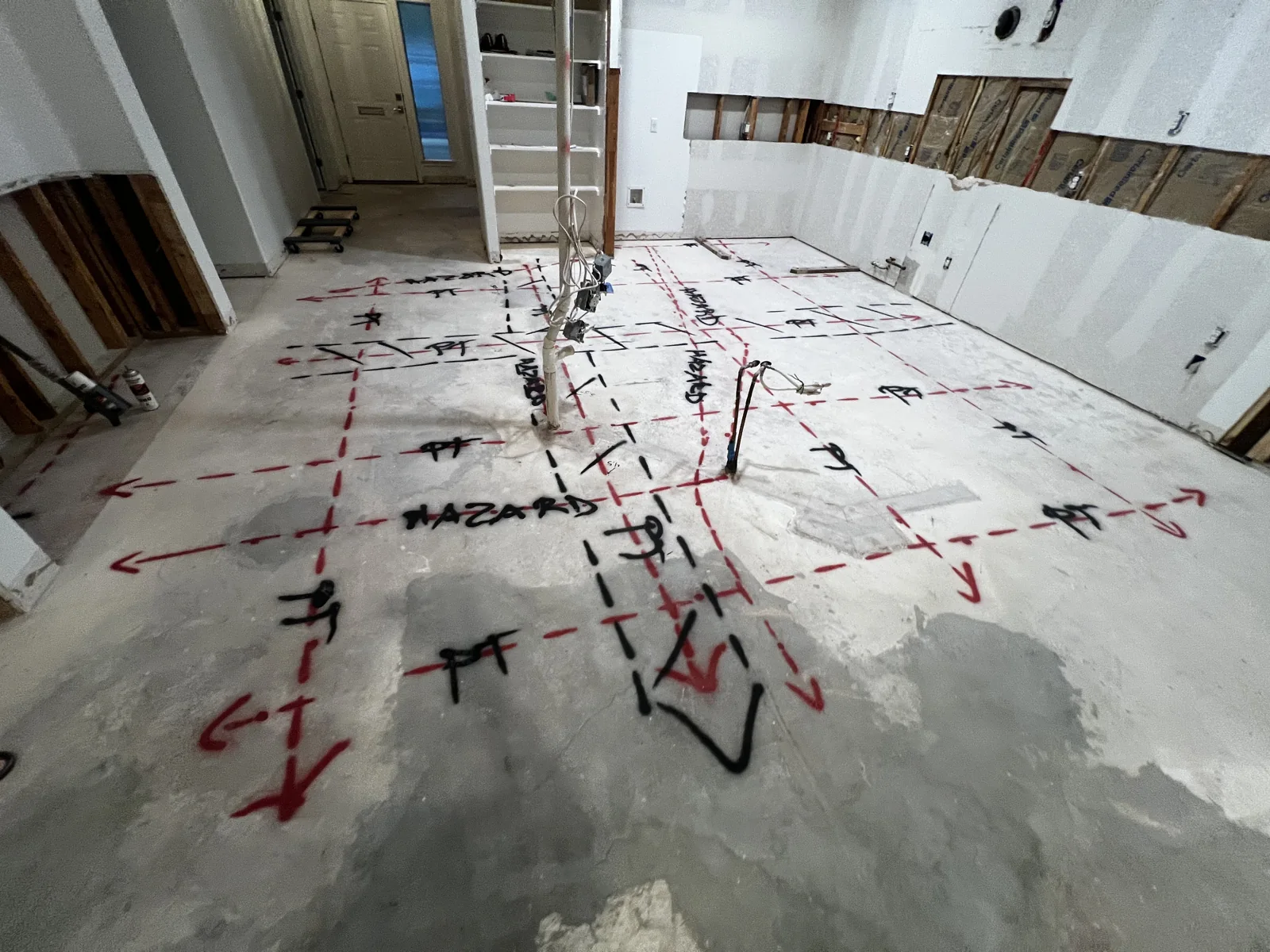 Marked concrete in an interior renovation area